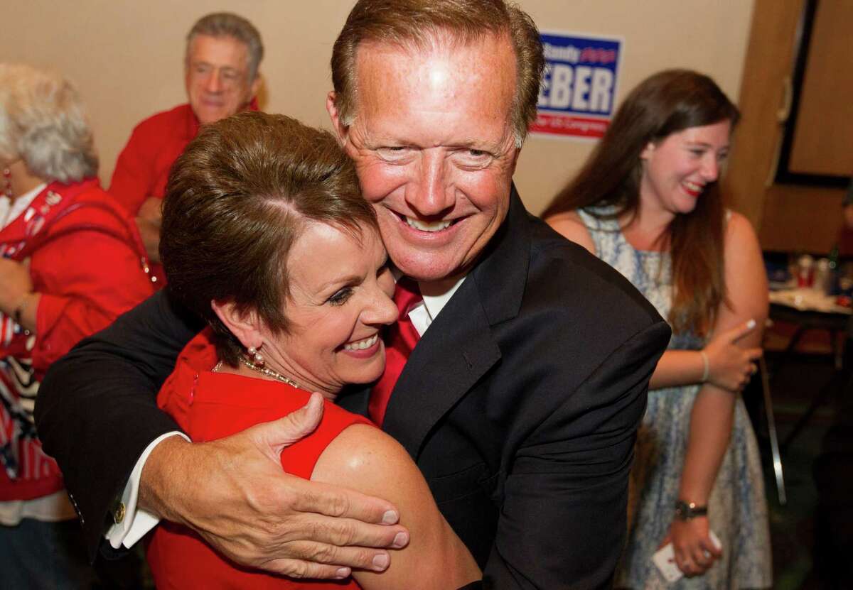 Republican candidate for Congressional District 14 Randy Weber is hugged by his wife Brenda after hearing early election returns at the South Shore Harbor Resort and Conference Center on Tuesday, Nov. 6, 2012, in League City. ( J. Patric Schneider / For the Chronicle )