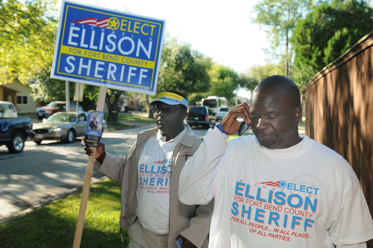 Michael Ellison, candidate for Sheriff of Fort Bend County, walks the streets near Ridgegate Elementary School while greeting voters and residents on Election Day. Freelance photo by Jerry Baker