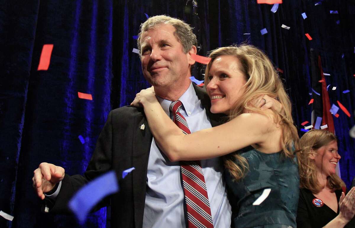Democratic Sen. Sherrod Brown, left, is hugged by his daughter, Liz, as they celebrate at the Ohio Democratic party election night celebration Tuesday, Nov. 6, 2012, in Columbus, Ohio. Brown defeated GOP challenger Josh Mandel, the state treasurer. (AP Photo/Tony Dejak)