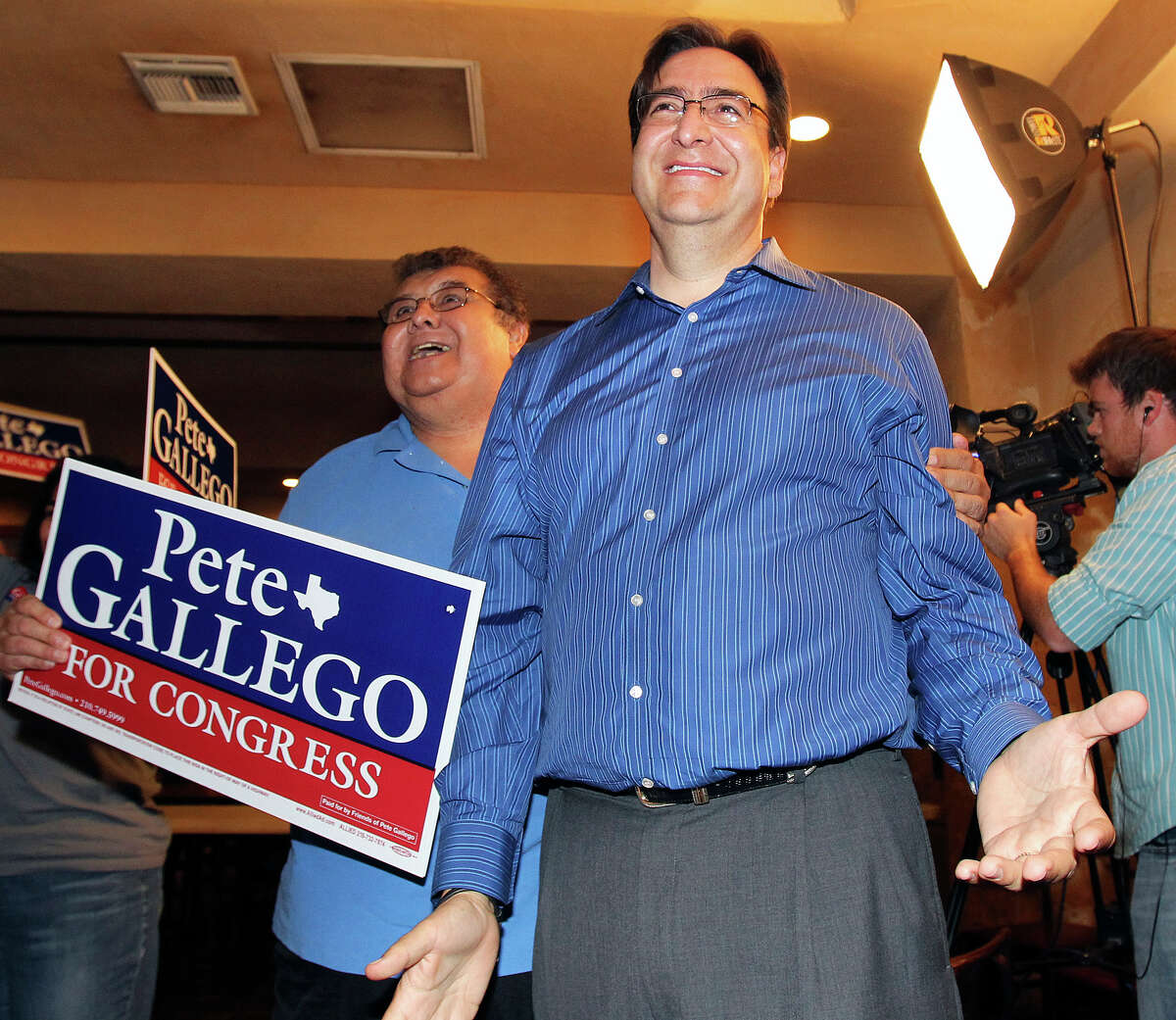 Pete Gallego reacts to a televised report of a large lead larte in the night during the election night watch party for State Representative Pete Gallego, D-Alpine, who is challenging U.S. Representative Francisco Canseco for his seat in the U.S. House District 23 on November 6, 2012.