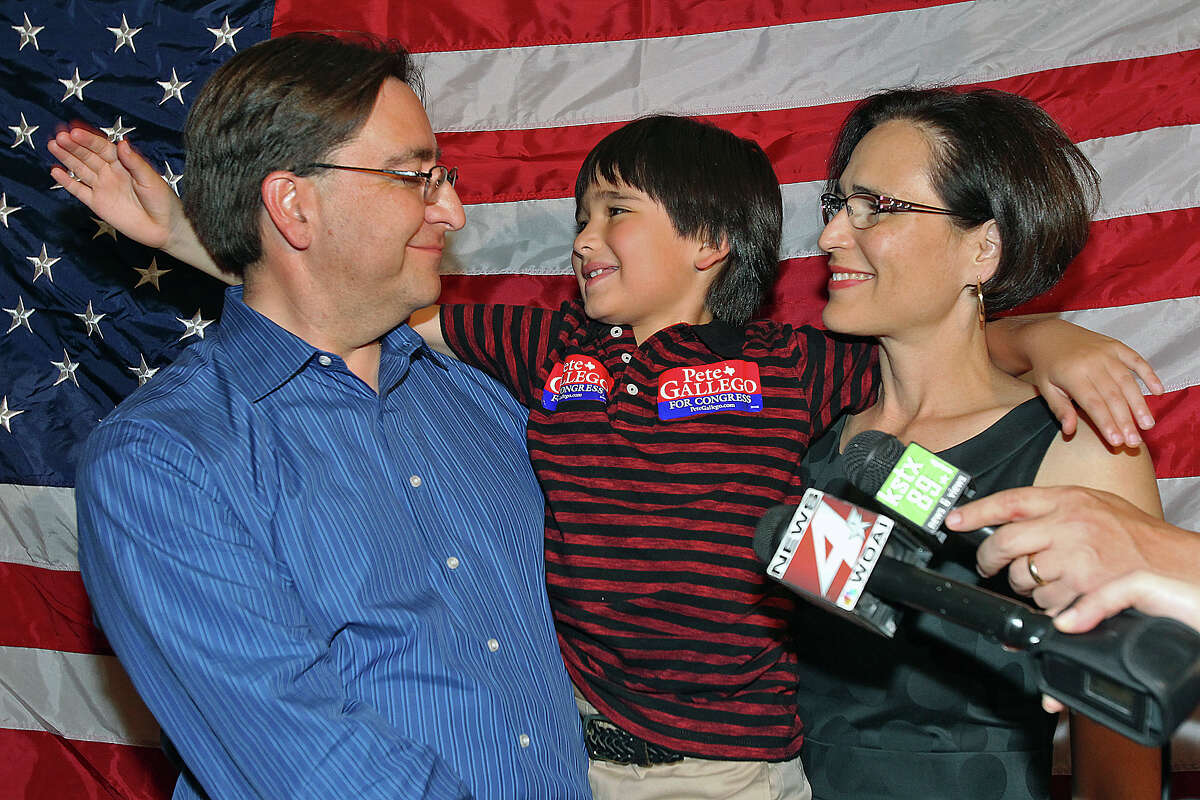 Pete Gallego gets a pat on the back from his son Nicolas as wife Elena listens to his victory speech at the election night watch party for State Representative Pete Gallego, D-Alpine, who is challenging U.S. Representative Francisco Canseco for his seat in the U.S. House District 23 on November 6, 2012.