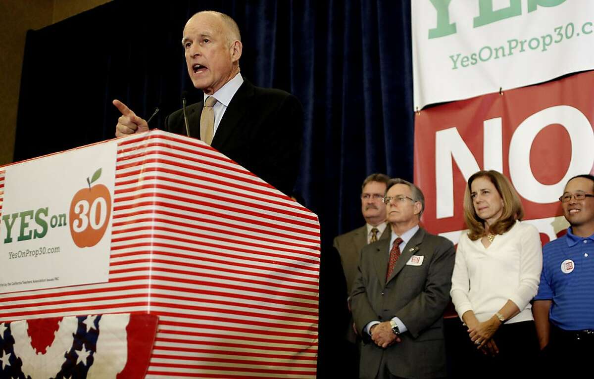 California Governor Jerry Brown joins supporters of the "Yes on 30" and "No on 32" campaigns as they gather at the Sheraton Grand hotel in downtown in Sacramento, Calif., on Tuesday Nov. 6, 2012, to watch election night returns.
