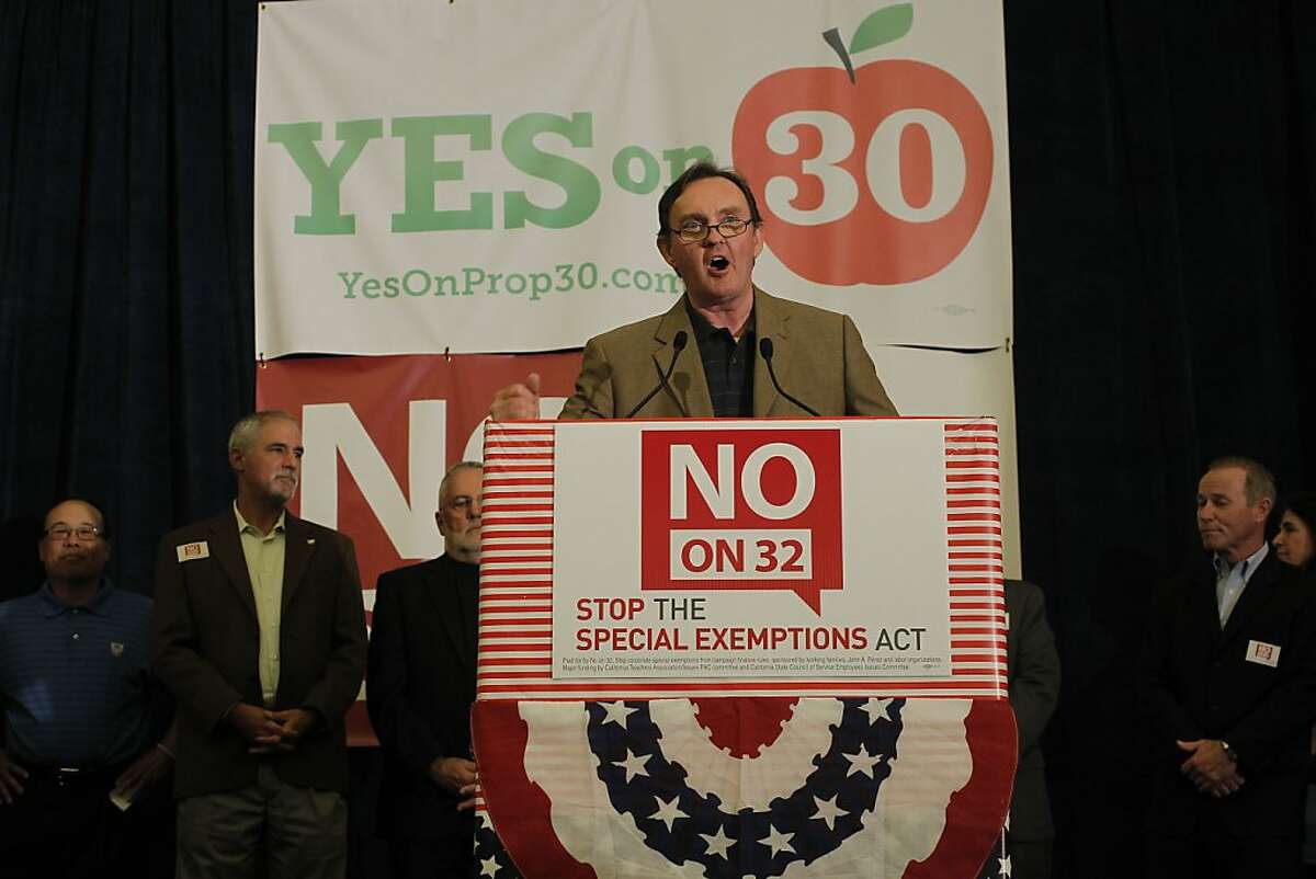 Labor leader Art Pulaski joins supporters of the "Yes on 30" and "No on 32" campaigns as they gather at the Sheraton Grand hotel in downtown in Sacramento, Calif., on Tuesday Nov. 6, 2012, to watch election night returns.
