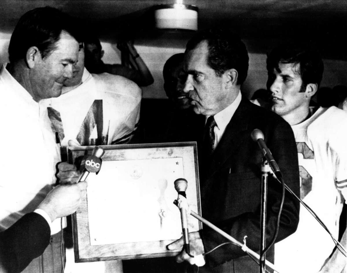 Texas coach Darrell Royal receiving the proclamation from President Richard Nixon in 1969 that the Texas Longhorns were the national champions. The Nixon photo in the locker room after the 1969 Shootout with Arkansas when the schools were Nos. 1-2.