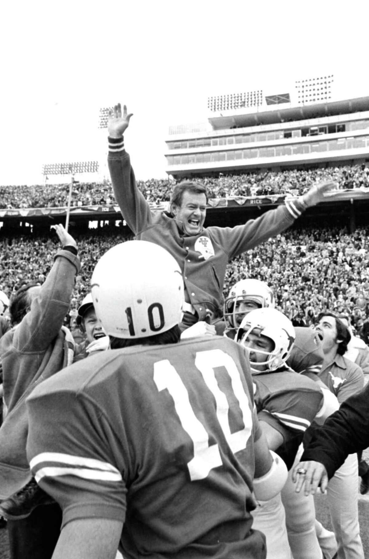 FILE - This Jan. 1, 1973 file photo shows Texas coach Darrell Royal being carried off the field by his players after the Longhorns defeated the University of Alabama, 17-13, in the Cotton bowl in Dallas, Tex. The University of Texas says former football coach Darrell Royal, who won two national championships and a share of a third, has died. He was 88. UT spokesman Nick Voinis on Wednesday, Nov. 7, 2012 confirmed Royal's death in Austin.(AP Photo/File)