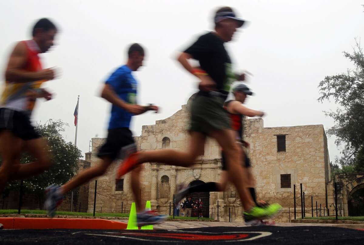 Runners in the Rock 'n' Roll San Antonio Marathon & 1/2 pass the Alamo Sunday, Nov. 13, 2011. (SAN ANTONIO EXPRESS-NEWS)
