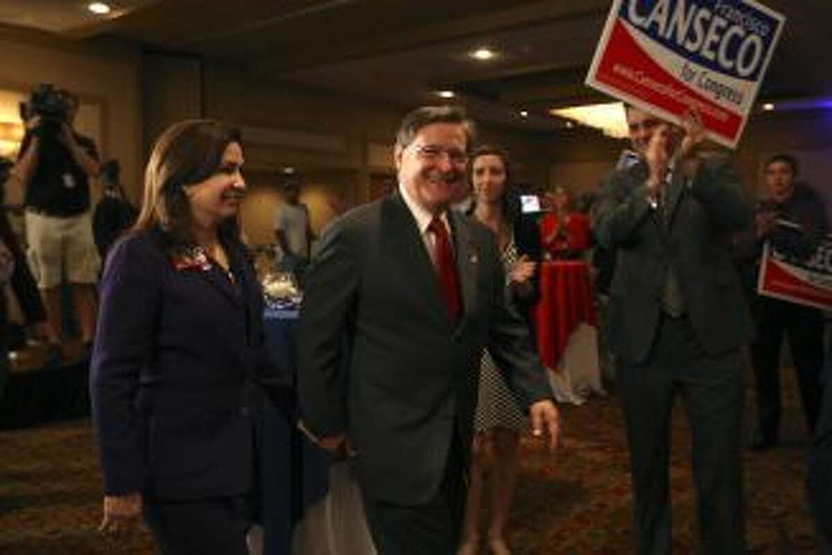 U.S. Rep. Francisco "Quico" Canseco, R-San Antonio, and his wife, Gloria, arrive at a campaign rally. Canseco said it was too early to concede the race. Photo: Jerry Lara, Staff / 2012 San Antonio Express-News