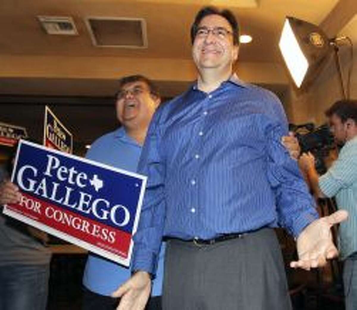 State Rep. Pete Gallego, D-Alpine, reacts to a televised report of a large lead late in the night on Tuesday. Photo: Tom Reel, Staff / 2012 San Antono Express-News