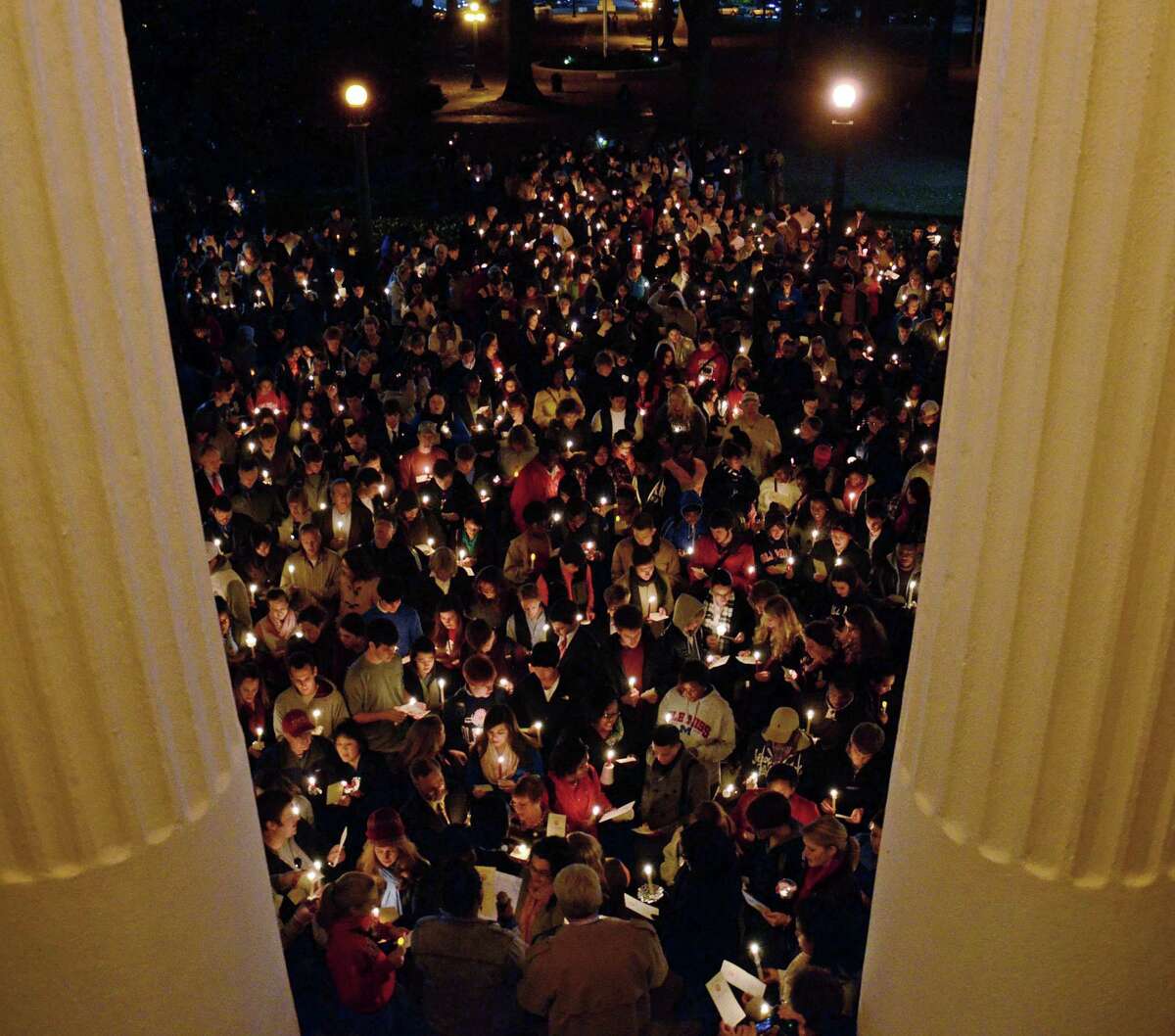 A large crowd made up of primarily of students, faculty and staff listen to University of Mississippi Chancellor Dr. Dan Jones, speak from the steps of the Lyceum during the "We are One Mississippi" candlelight walk on the campus in Oxford, Miss., Wednesday, Nov. 7, 2012. The walk was organized to condemn a Tuesday night protest against the re-election of President Barack Obama, during which some students chanted political slogans while others used derogatory racial statements and profanity, according to a statement from the university. (AP Photo/The Daily Mississippian, Thomas Graning) MANDATORY CREDIT