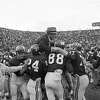 Alabama football players hoist Coach Paul (Bear) Bryant to their shoulders after the Crimson Tide finished an unbeaten, untied season with a 31-0 triumph over Auburn at Birmingham, Alabama, Dec. 5, 1966. Identifiable players are (from left) John Mosley, Ray Perkins, Jerry Duncan and Wayne Trimble.