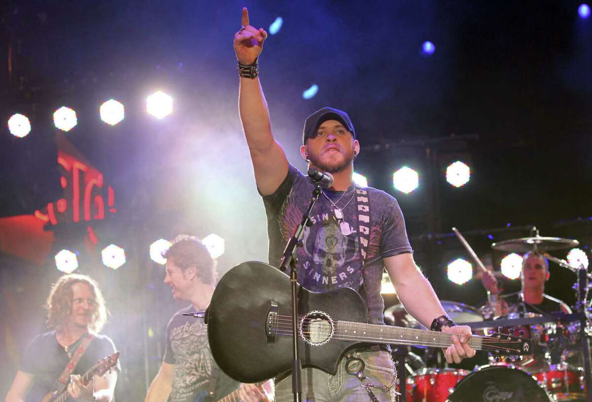 The Academy of Country Music hosts a free all star concert for fans as the country music artist Brantley Gilbert (New Artist of the Year Nominee) performs at the ACM Fremont Street Experience on Friday, Mar. 30, 2012, in Las Vegas. (AP Photo/Jeff Bottari)