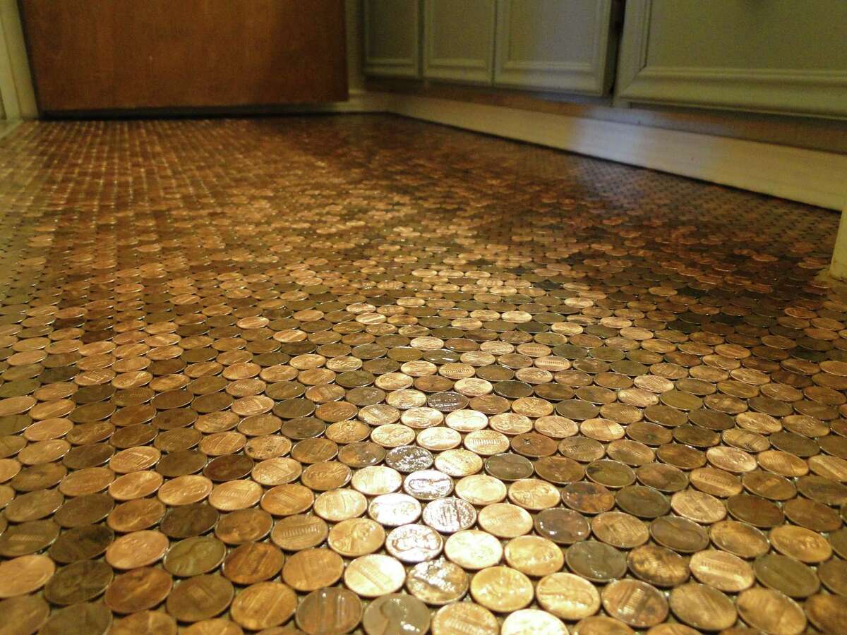 New Braunfels homeowner Doreen Fisher used almost 10,000 pennies to a bathroom floor. She kept the random pattern and the variations in color to give the floor a patina.