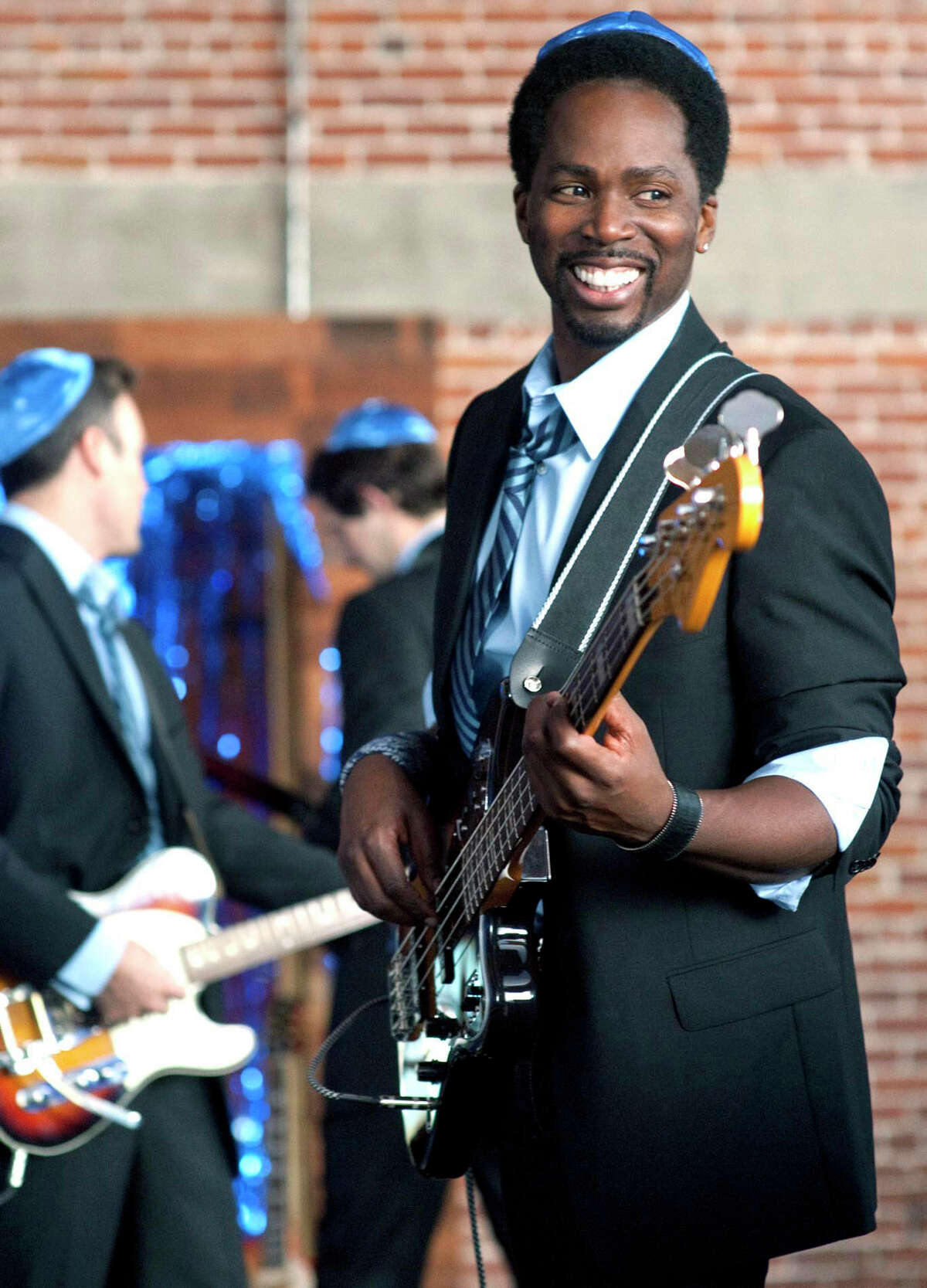 Harold Perrineau costars on TBS' new comedy, " Wedding Band, " premiering Saturday. He already played the bass, but had to learn the cello, saxophone, keyboards and trombone for the series. (MCT)