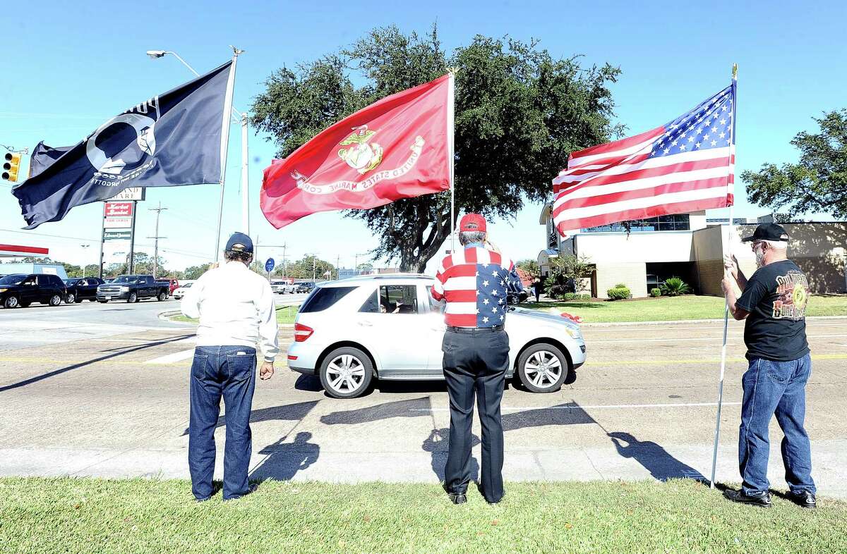 Hundreds gather on Nederland Avenue on Friday, November 9, 2012, to welcome home Sergeant Joshua Yarbrough as he is escorted by the Patriot Guard Riders to his home in Port Arthur. The marine had suffered a severe injury while leading his men on a routine patrol in Afghanistan when an IED was blown. Photo taken: Randy Edwards/The Enterprise