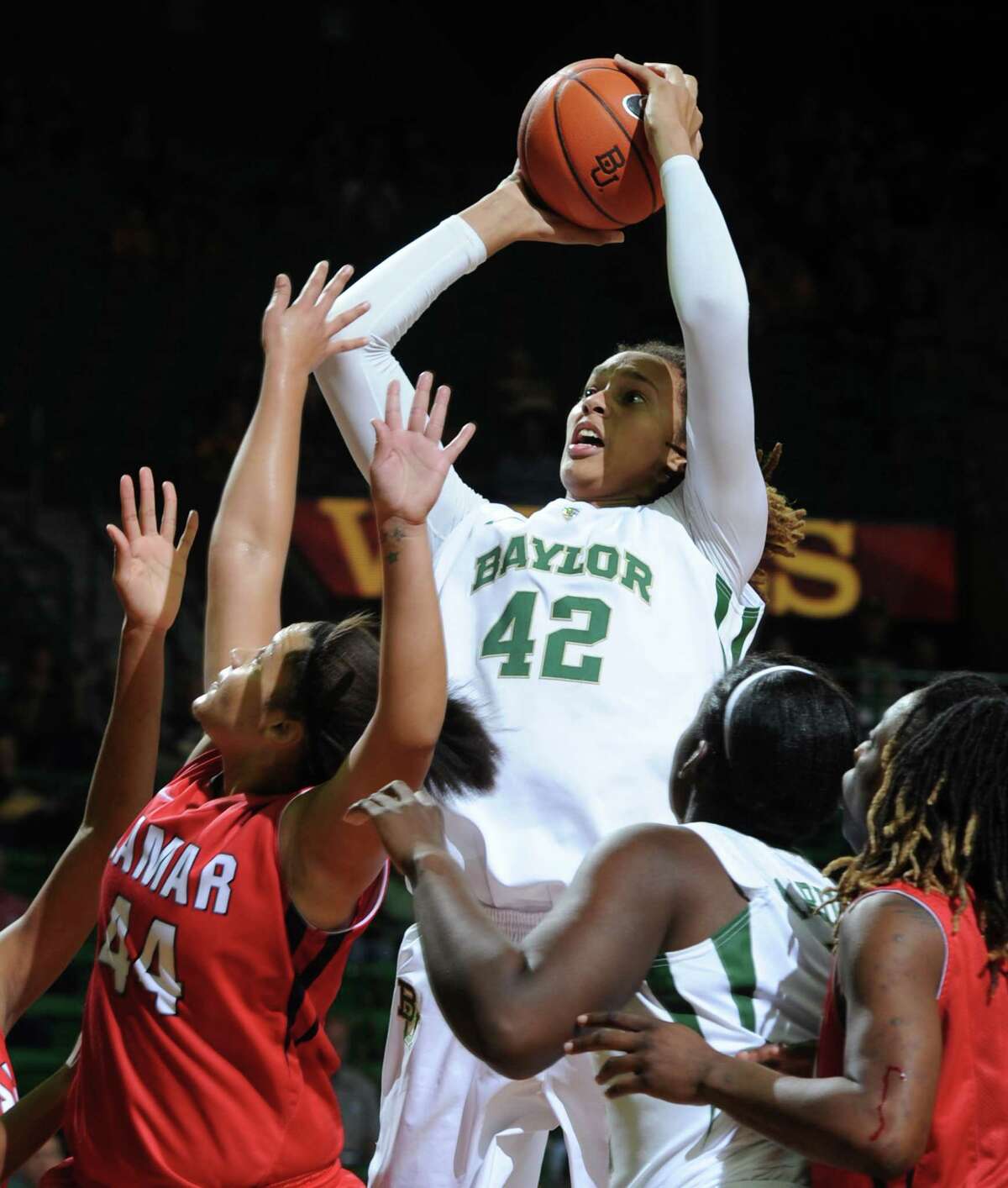 Baylor's Brittney Griner (42) shoots over Lamar's Kristina Higgins, left, during the second half of an NCAA college basketball game, Friday, Nov. 9, 2012, in Waco, Texas. Baylor won 80-34. (AP Photo/Waco Tribune Herald, Rod Aydelotte)