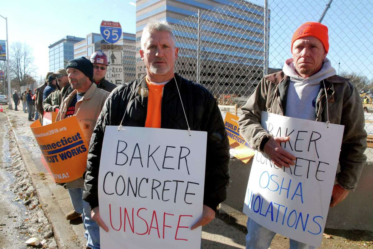 Members of the Connecticut Laborer's District Council protest across from the Government Center on Friday November 9, 2012 in front of the old Advocate building in Stamford, Conn. where Baker Concrete is working.