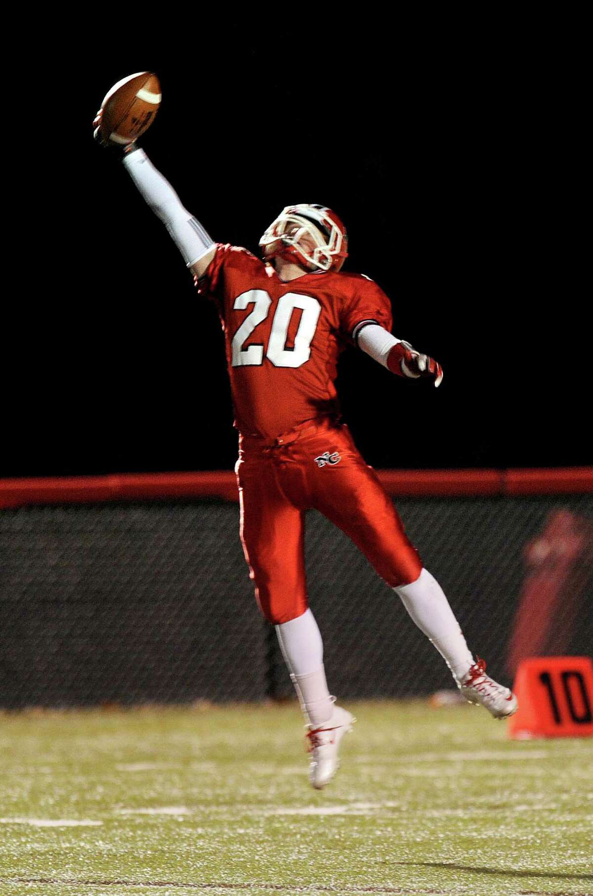 New Canaan's Andrew Read makes a one-handed catch during Friday's football game against Stamford at New Canaan High School on November 9, 2012.