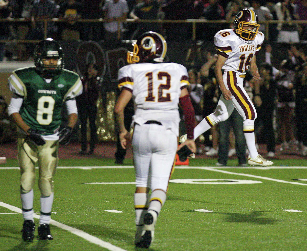 Harlandale's Rueben Garcia (right) reacts after making a field goal to tie the game 29-29 late in second half action of the Frontier Bowl as McCollum's Noe Trevino (left) and Harlandale's Brandon Ramon look on Friday Nov. 9, 2012 at Harlandale Memorial Stadium. Harlandale won in double overtime 43-36.