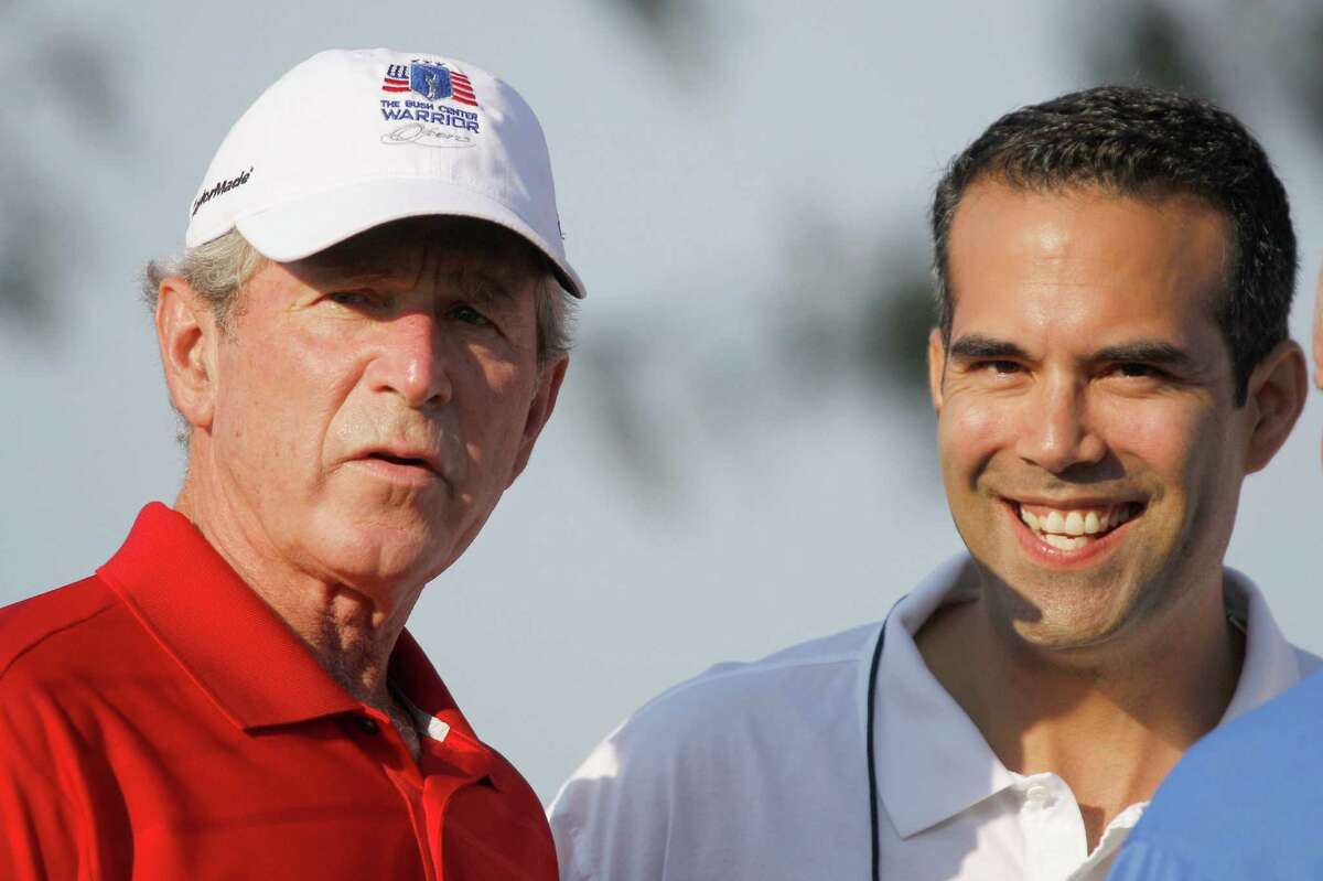 In this Sept. 24, 2012, photo, George P. Bush stands with his uncle former President George W. Bush, during the Bush Center Warrior Open in Irving. George P. Bush, son of one-time Florida Gov. Jeb Bush, has made a campaign filing in Texas that is required of candidates planning to run for state office, an official said on Nov. 8, 2012.