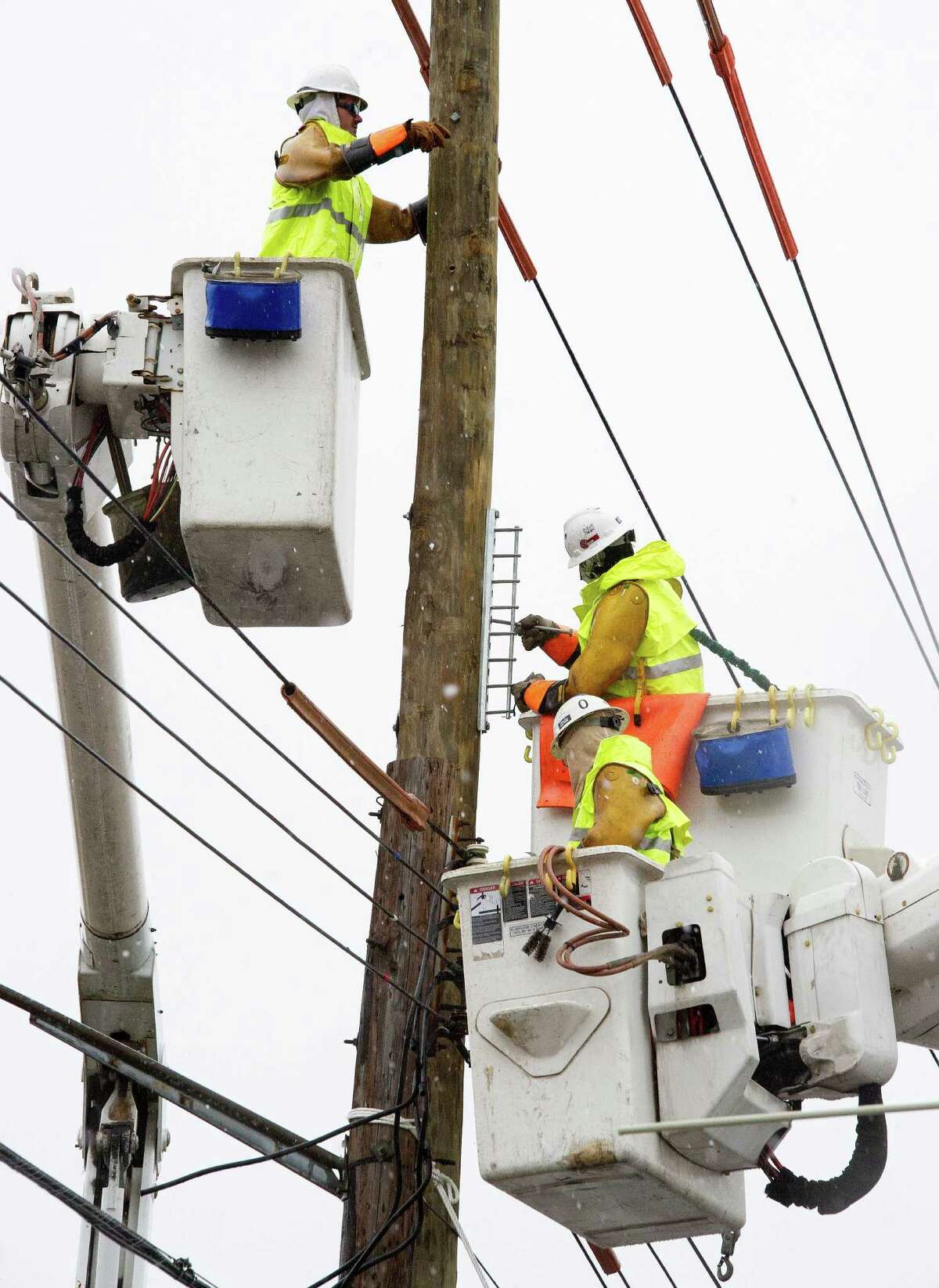 Linemen from Chain Electric, a contract utility crew that drove in from Mississippi , works to prep a utility pole November 7, 2012 for a new transformer and help to restore electric power that has been out since Hurricane Sandy struck the East Coast, in the community of Oakwood Beach, on Staten Island, New York. AFP PHOTO/Paul J. RichardsPAUL J. RICHARDS/AFP/Getty Images