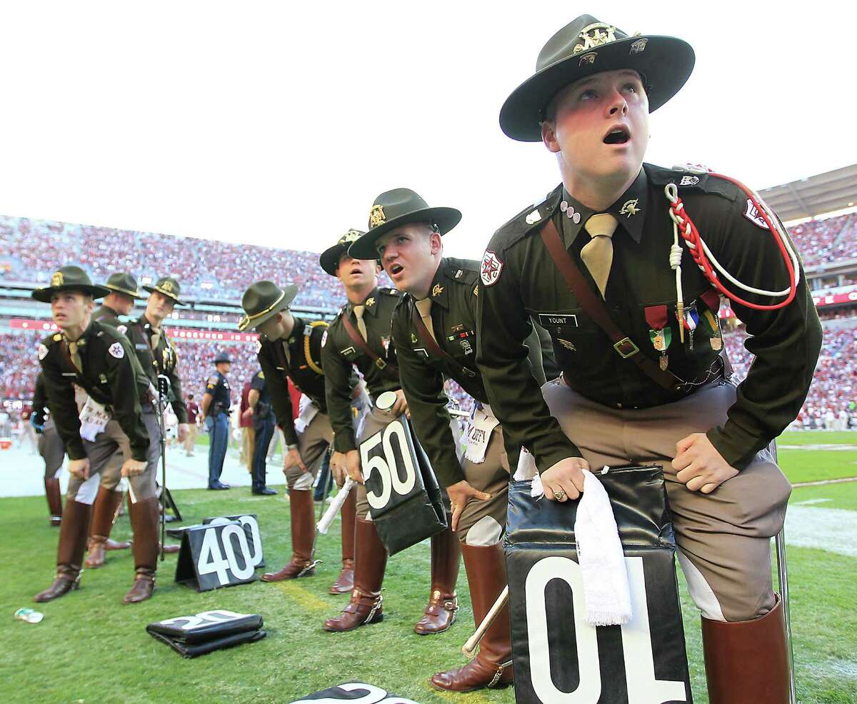 Texas A&M cadets prepare for half time as they participate in a cheer during the second quarter of a college football game. A&M beat West Point and Annapolis in a ranking of America's fittest universities.