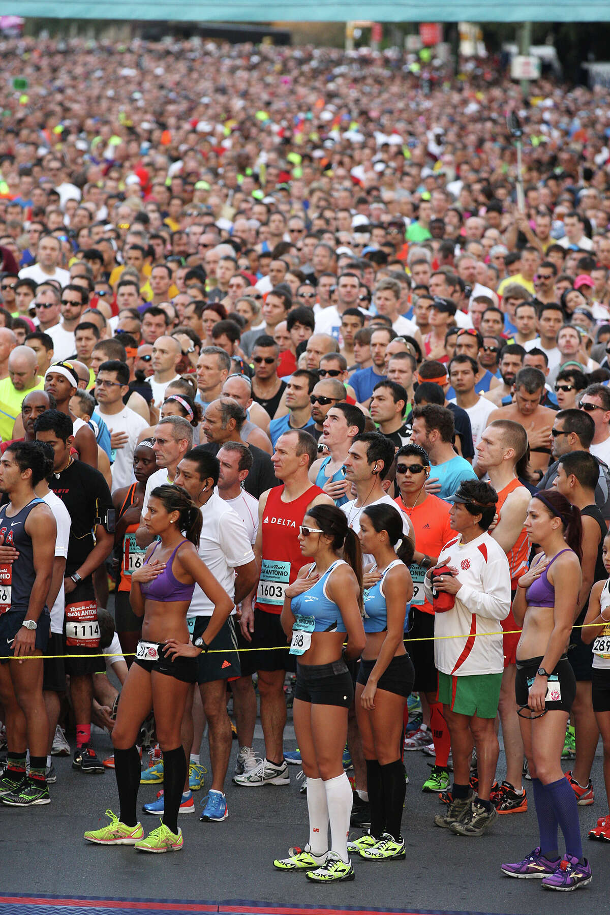 Around 25,000 runners are in place as the National Anthem is sung before the start of the Rock 'n' Roll San Antonio Marathon and 1/2 Marathon, Sunday, Nov. 11, 2012.