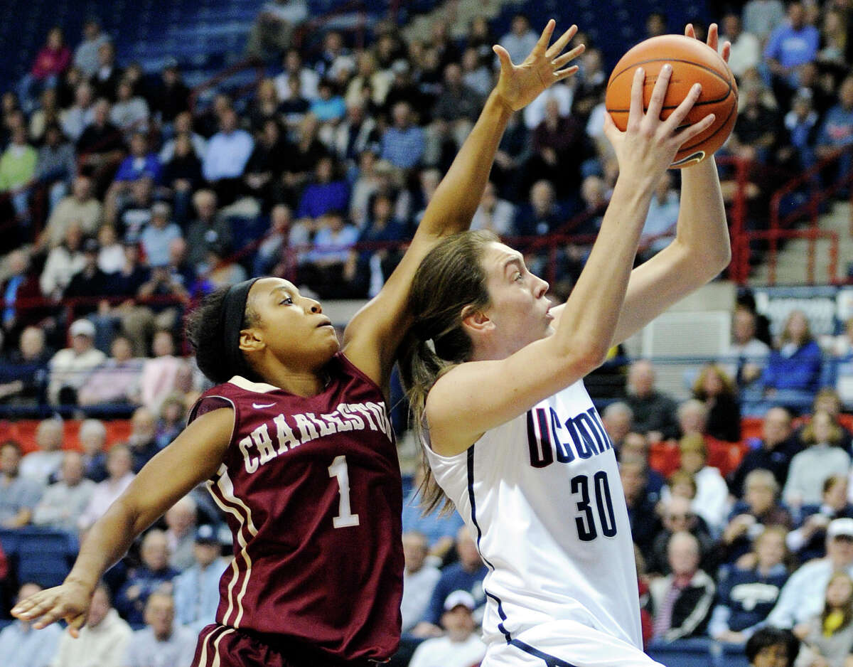 Connecticut's Breanna Stewart (3) drives past Charleston's Alyssa Frye during the first half of an NCAA college basketball game in Storrs, Conn., Sunday, Nov. 11, 2012. (AP Photo/Fred Beckham)