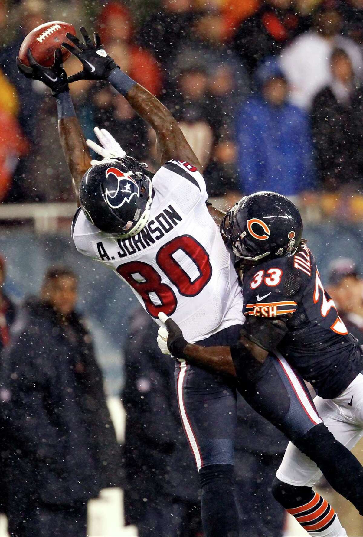 Chicago Bears cornerback Charles Tillman (33) breaks up a pass intended for Houston Texans wide receiver Andre Johnson (80) in the first half an NFL football game, Sunday, Nov. 11, 2012, in Chicago. (AP Photo/Charles Rex Arbogast)