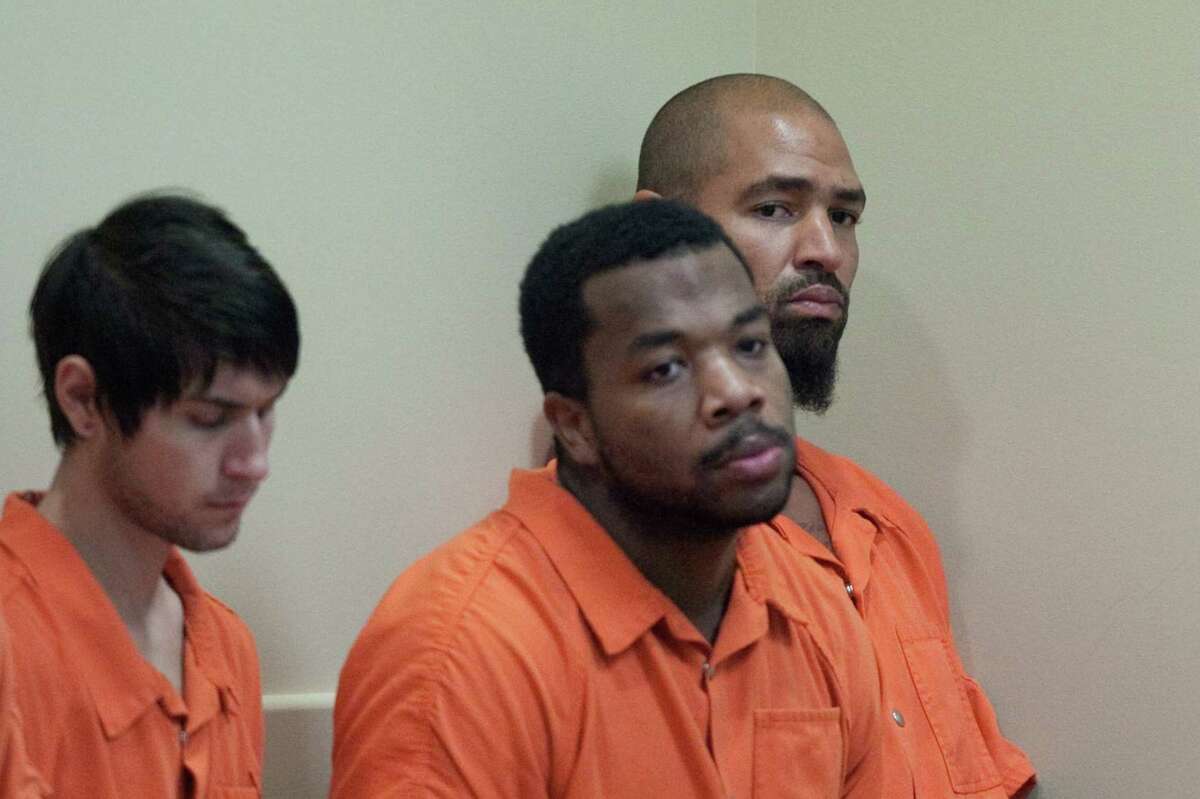 Former Seattle Seahawks player Jerramy Stevens, far right, listens during a bail hearing for Stevens in Kirkland Municipal Court. Stevens appeared in court for a domestic violence probable cause hearing. He was released without conditions by the judge who didn't find probable cause to hold him.