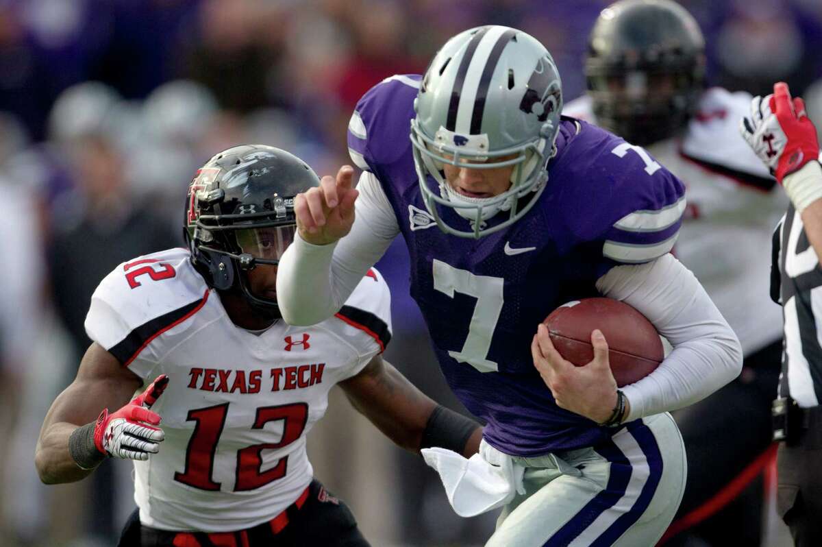 Kansas State quarterback Collin Klein (7) breaks past Texas Tech safety D.J. Johnson (12) for a touchdown during the second half of an NCAA college football game in Manhattan, Kan., Saturday, Oct. 27, 2012. (AP Photo/Orlin Wagner)