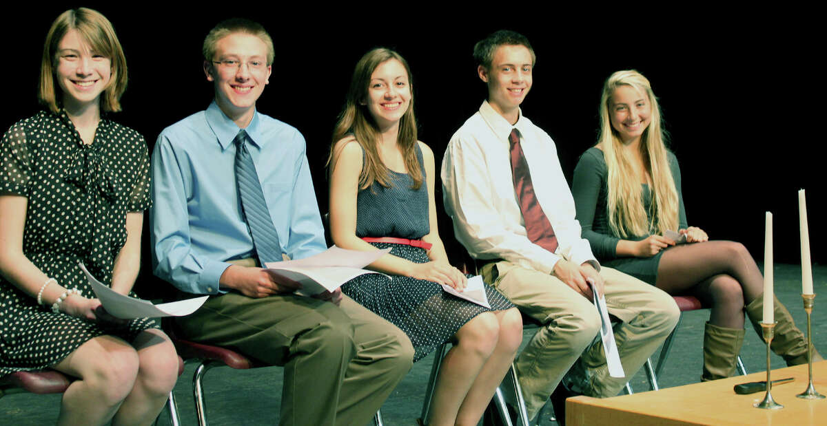 Playing key roles in the Oct. 22, 2012 indction ceremony for New Milford High School's chapter of the National Honor Society were, from left to right, event chairman Lindsey Partelow; Quentin Leitz, the chapter president; Kristina Chamberlin, vice president; James Curley, secretary; and Mia Carlone, treasurer. Courtesy of Cathy Neill