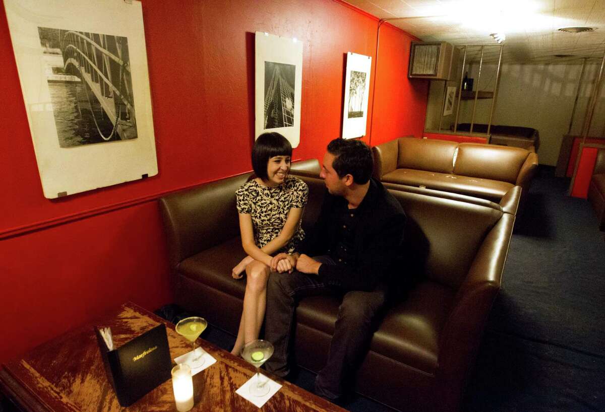 Justice Tirapelli-Jamail and his girlfriend Gabriella Hulet enjoy their drinks in the upstairs lounge of the Marfreless bar in River Oaks on Wednesday, Nov. 7, 2012, in Houston.( J. Patric Schneider / For the Chronicle )