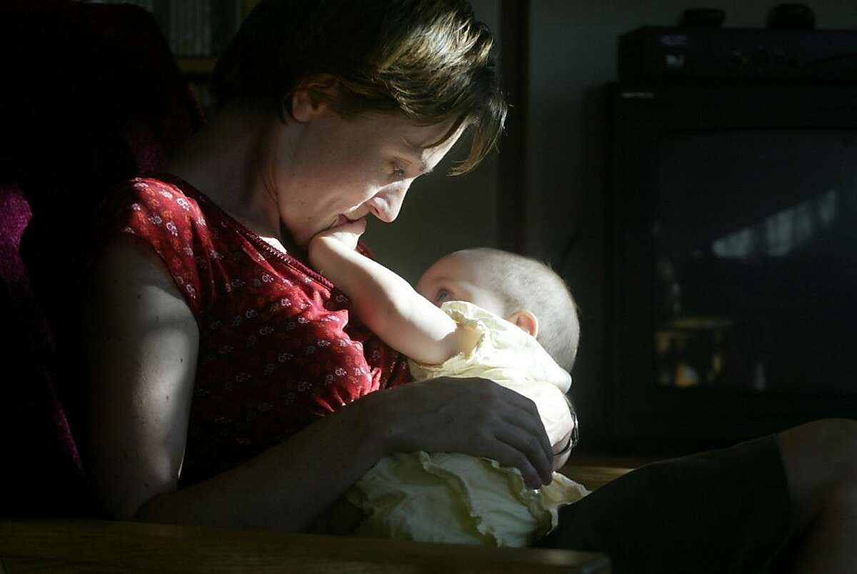 Katrina Friedman breastfeeds her 8 1/2 month old baby daughter, Ruby Alcorn at their home on 9/22/03 in San Francisco. Friedman has PBDEs in her breastmilk according to a study by The Enviornmental Working Group.