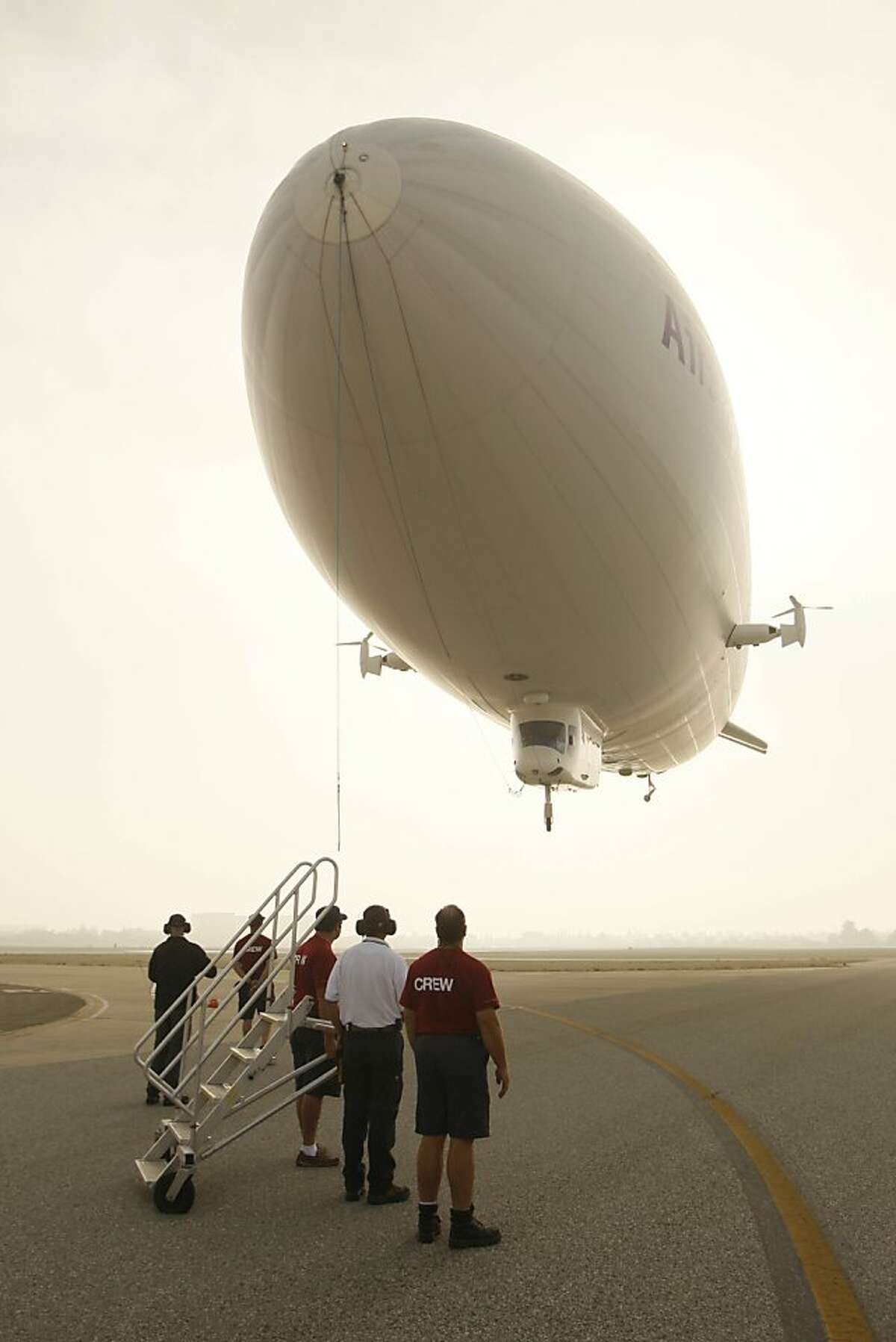 The ground crew prepares for the Zeppelin NT's landing at Moffet Field on Monday, October 27, 2008 in Mountain View, Calif.