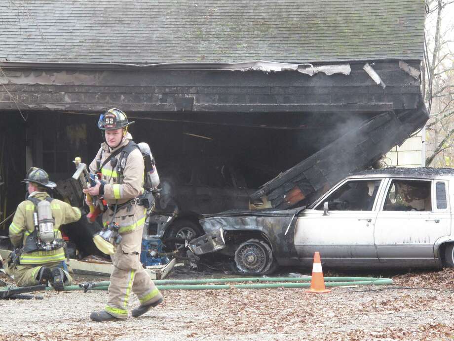 Man jumped out of car before it crashed into New Canaan house