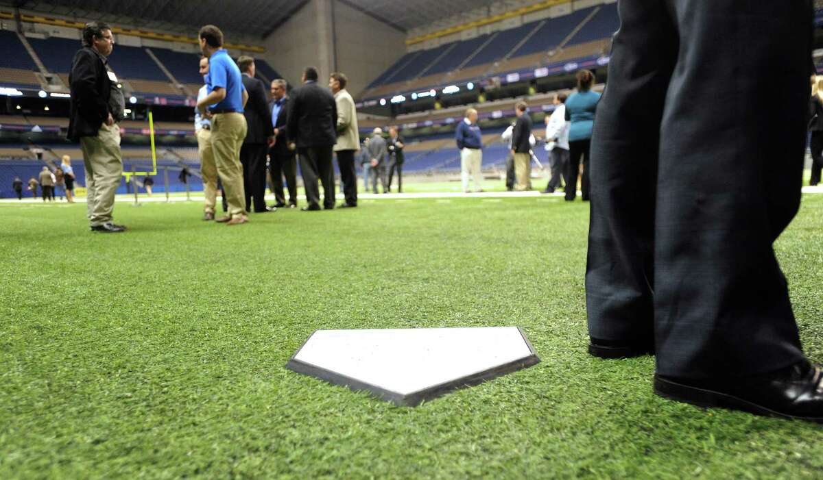 A temporary home plate is placed on the location of home plate when the San Diego Padres and the Texas Rangers play during "Big League Weekend," a two-game set in the Alamodome on March 29-30, 2013.