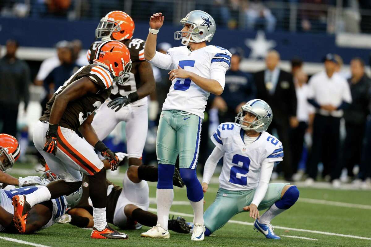 Dallas Cowboys kicker Dan Bailey (5) and Brian Moorman (2) watch as Bailey kicks a game-winning filed goal against the Cleveland Browns in overtime of an NFL football game Sunday, Nov. 18, 2012, in Arlington, Texas. The Cowboys won 23-20. (AP Photo/Sharon Ellman)