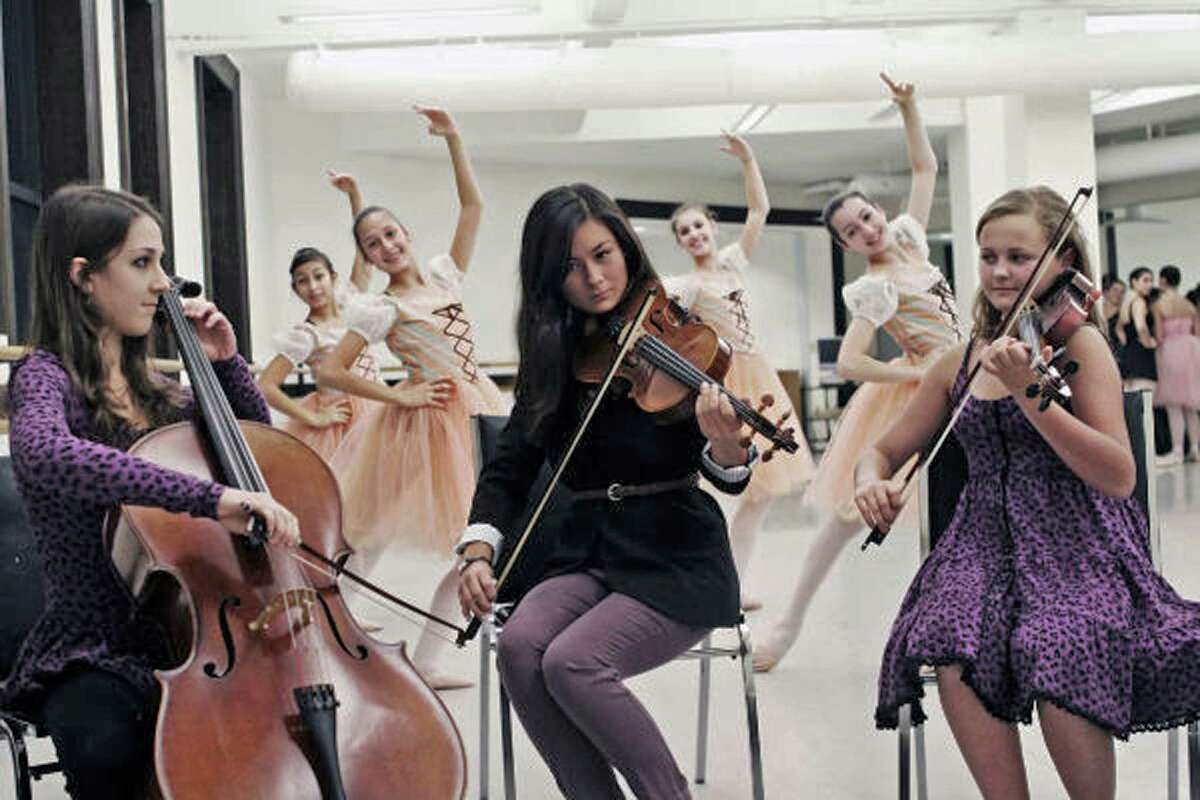 Pictured: Stamford Young Artist Philharmonic members Emily Azzarito, Lily Allen and Anna Leunis rehearse with Ballet of School of Stamford members Shirley Guerrero, Claudia Portugal, Claire Cohen and Lauren Mahr for Next Generation. The concert, which features collaborations between youth performing arts groups, will be held at the Palace Theatre in Stamford on Sunday, Nov. 25.