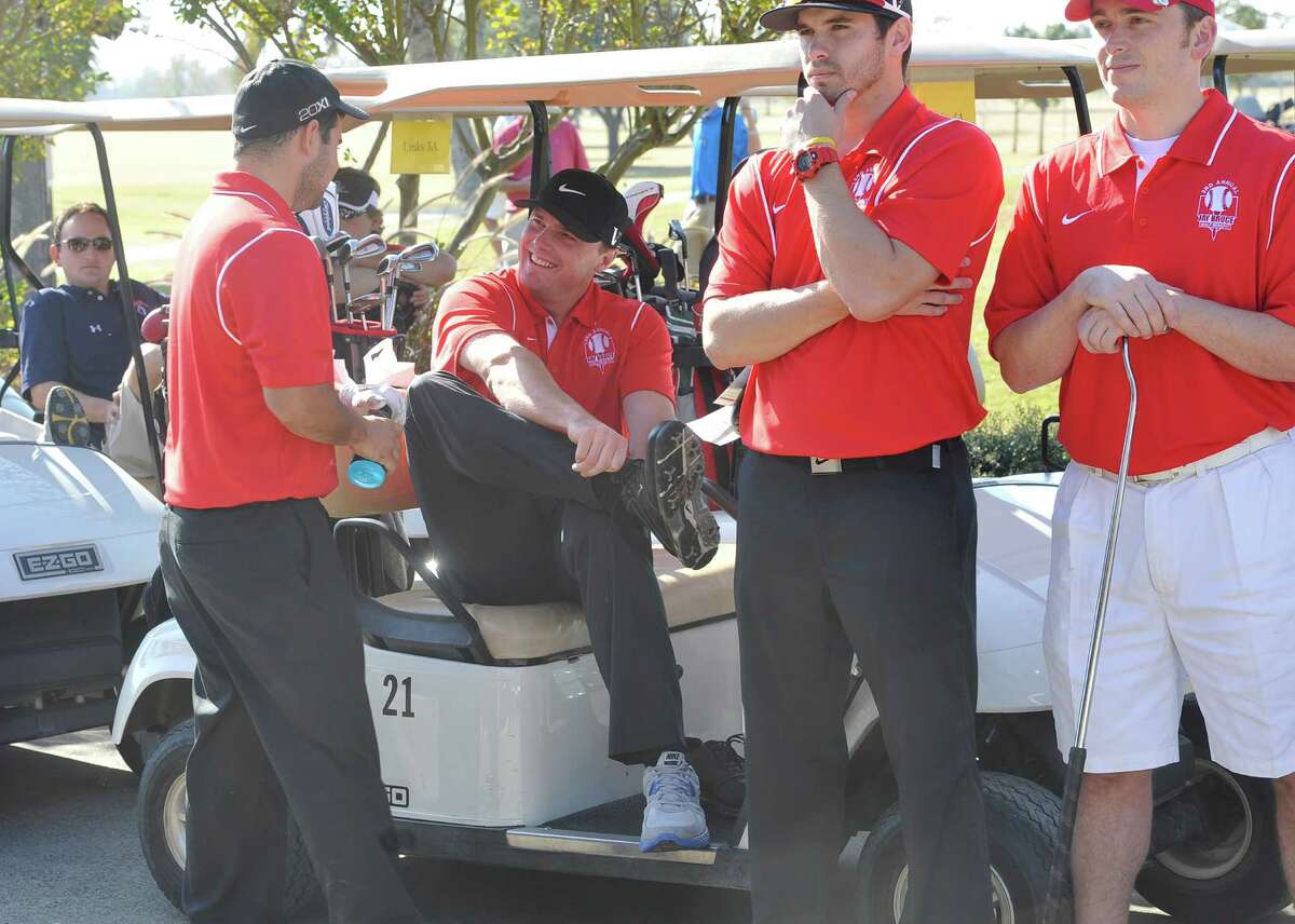 Jay Bruce, center, joins his team and changes into his golf shoes. The Third Annual Jay Bruce Golf Benefit was held Monday morning, November 19, 2012, at Bayou Din Golf Club. Proceeds benefit The Arc of Greater Beaumont and the Life Skills Department at West Brook High School. Dave Ryan/The Enterprise