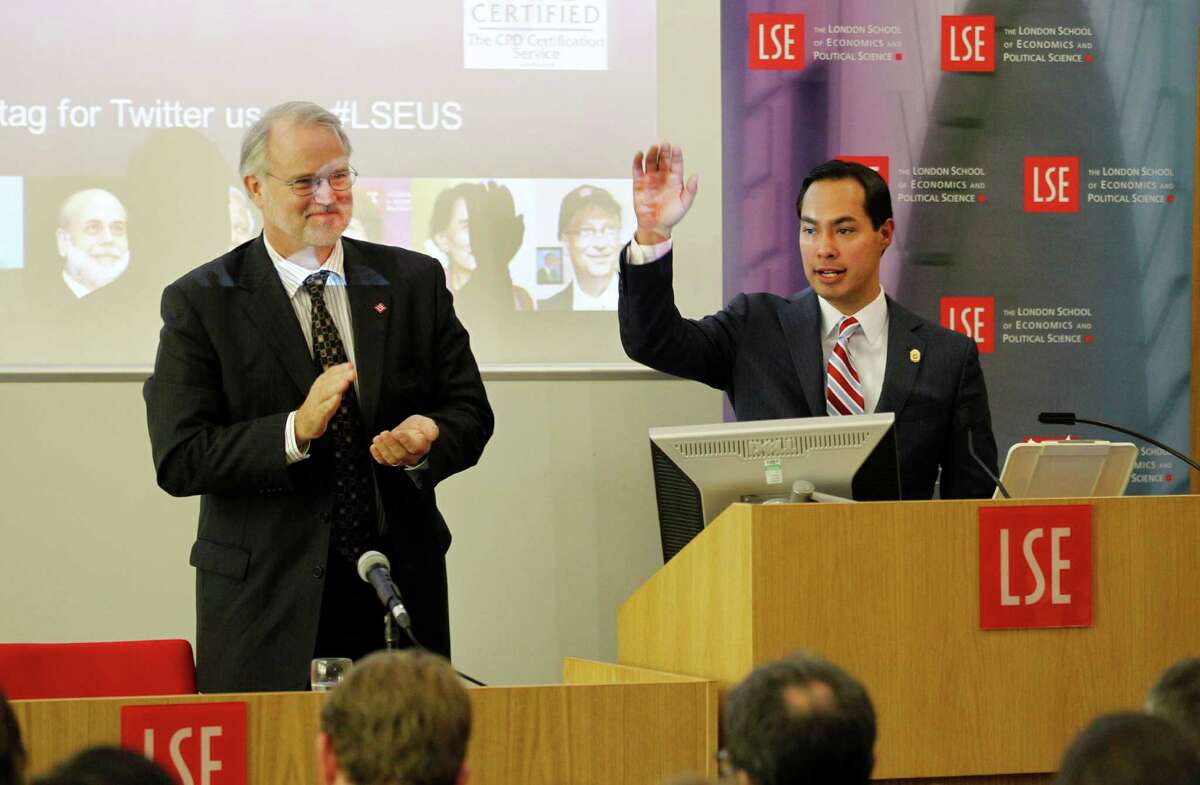 Mayor of San Antonio, Julian Castro, right, reacts to the applauds from Director of LSE Professor Craig Calhoun, left, and the students at the end of his speech to the students on "US Leadership in the 21st Century" at the London School of Economics and Political Science in London, Monday, Nov. 19, 2012.