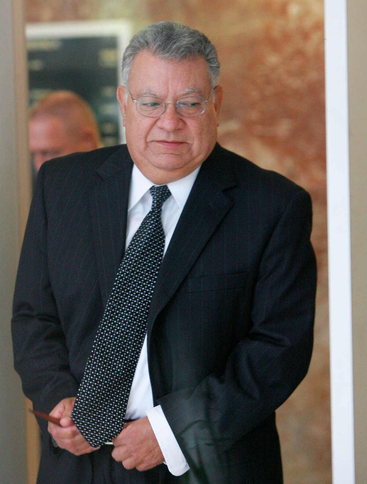 Gilberto Lopez, 70, was Stanford's chief accounting officer. He and Kuhrt remain in custody.