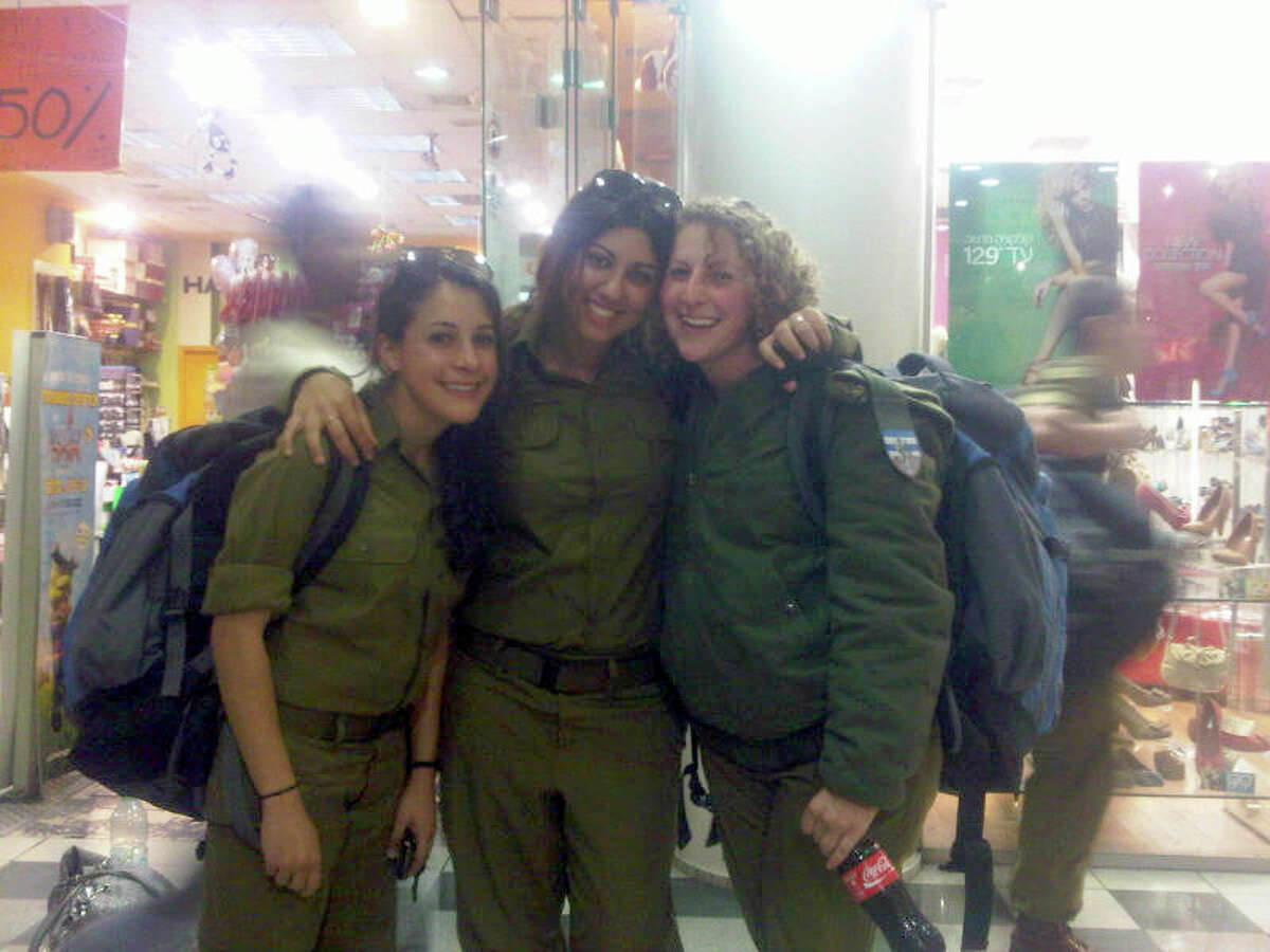 Houston native Ilana Diamond, 24, right, is shown with colleagues in the Israeli Army. She decided to stay in Israel after completing her service.