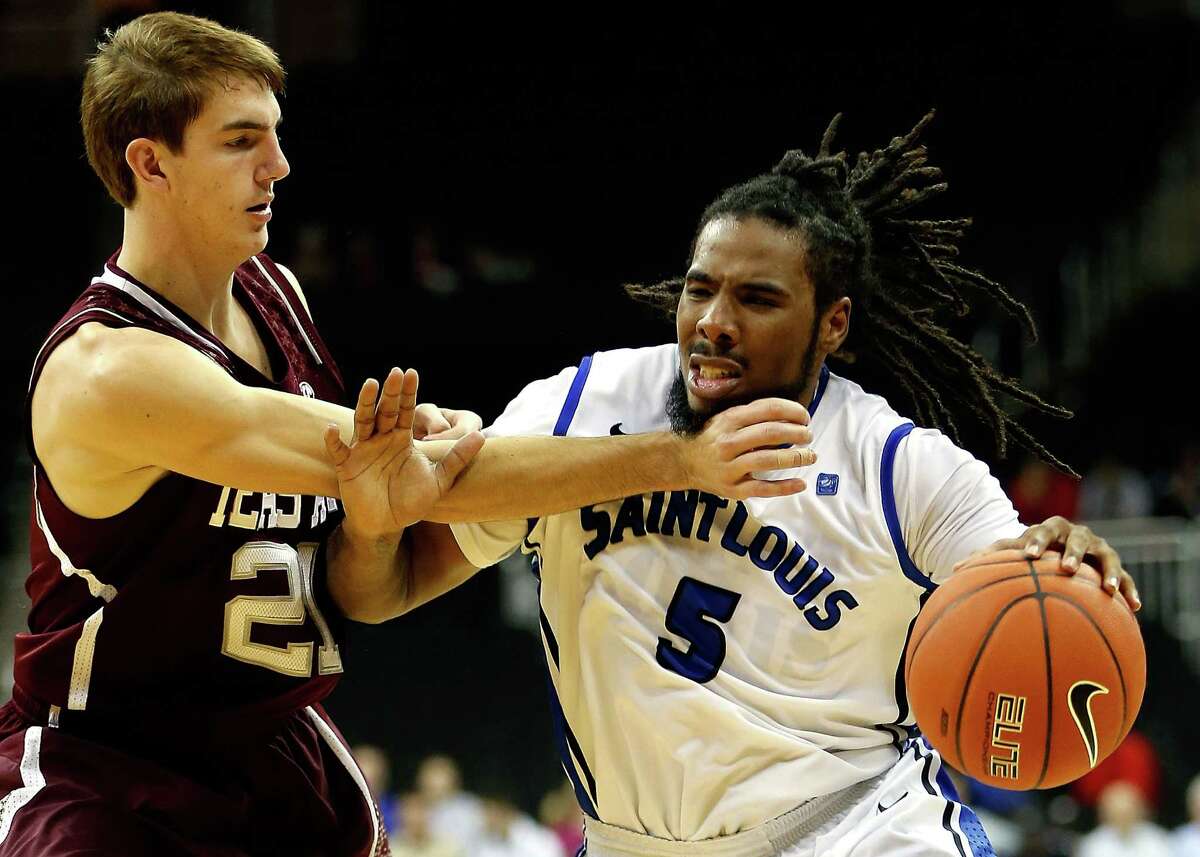 KANSAS CITY, MO - NOVEMBER 19: Jordair Jett #5 of the Saint Louis Billikens drives as Alex Caruso #21 of the Texas A&M Aggies defends during the CBE Hall of Fame Classic at Sprint Center on November 19, 2012 in Kansas City, Missouri. (Photo by Jamie Squire/Getty Images)