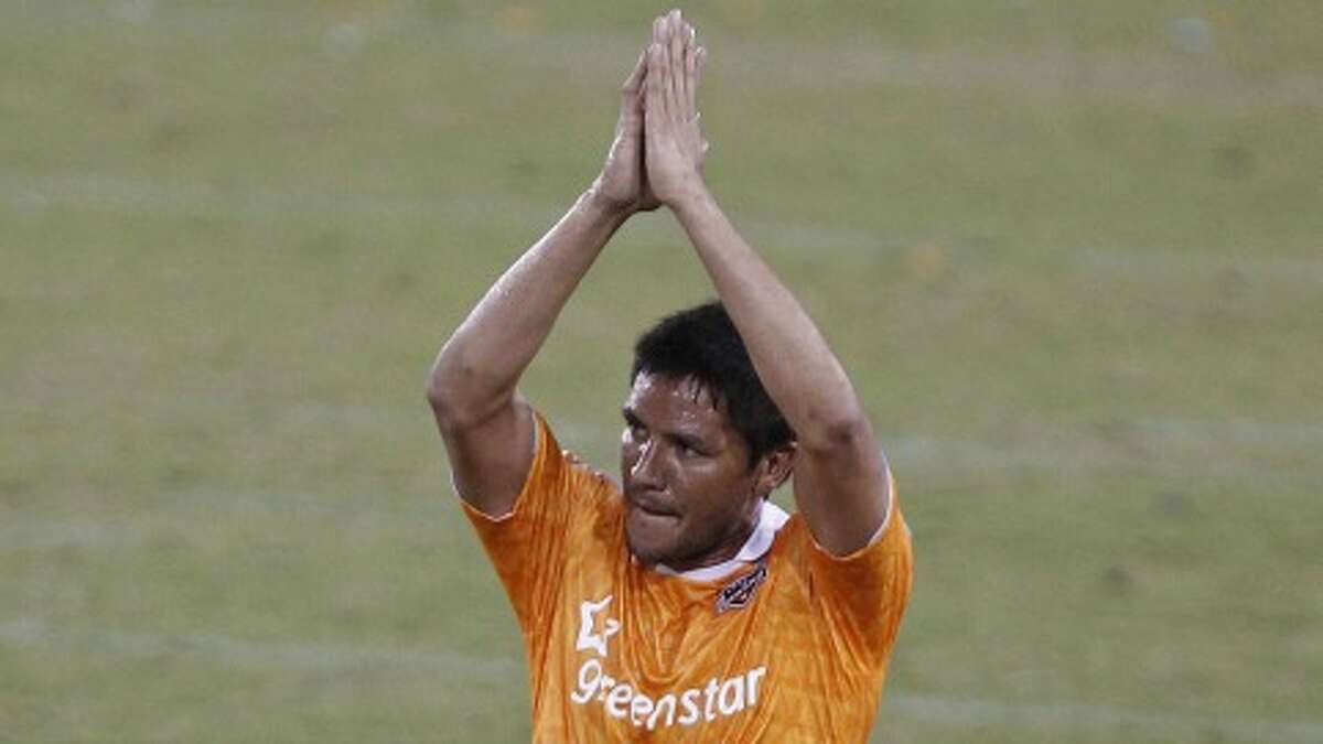 The Houston Dynamo's Brian Ching claps his hands as he leaves the game in the second period of MLS game action against the LA Galaxy at Robertson Stadium Sunday, Oct. 23, 2011, in Houston. ( James Nielsen / Chronicle )