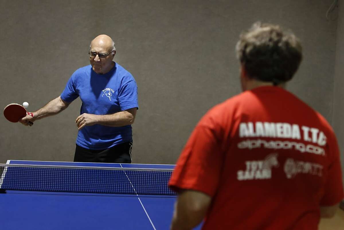 Dr. Les Prins plays table tennis for its health benefits. Here, he plays with coach Avishy Schmidt, right, at Alameda Table Tennis Club in Alameda, Calif., on Thursday, November 15, 2012.