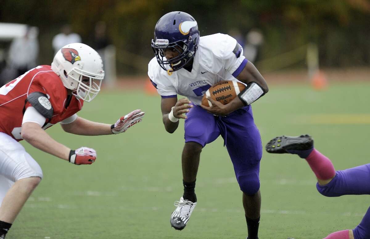Westhill's Davell Cotterell carries the ball during Saturday's football game against Greenwich High School at Westhill High School on October 27, 2012.