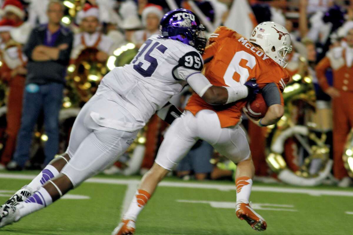 Texas quarterback Case McCoy (6) is sacked by TCU defensive end Devonte Fields (95) late in the first half of an NCAA college football game on Saturday, Nov. 22, 2012, in Austin, Texas. (AP Photo/Jack Plunkett)