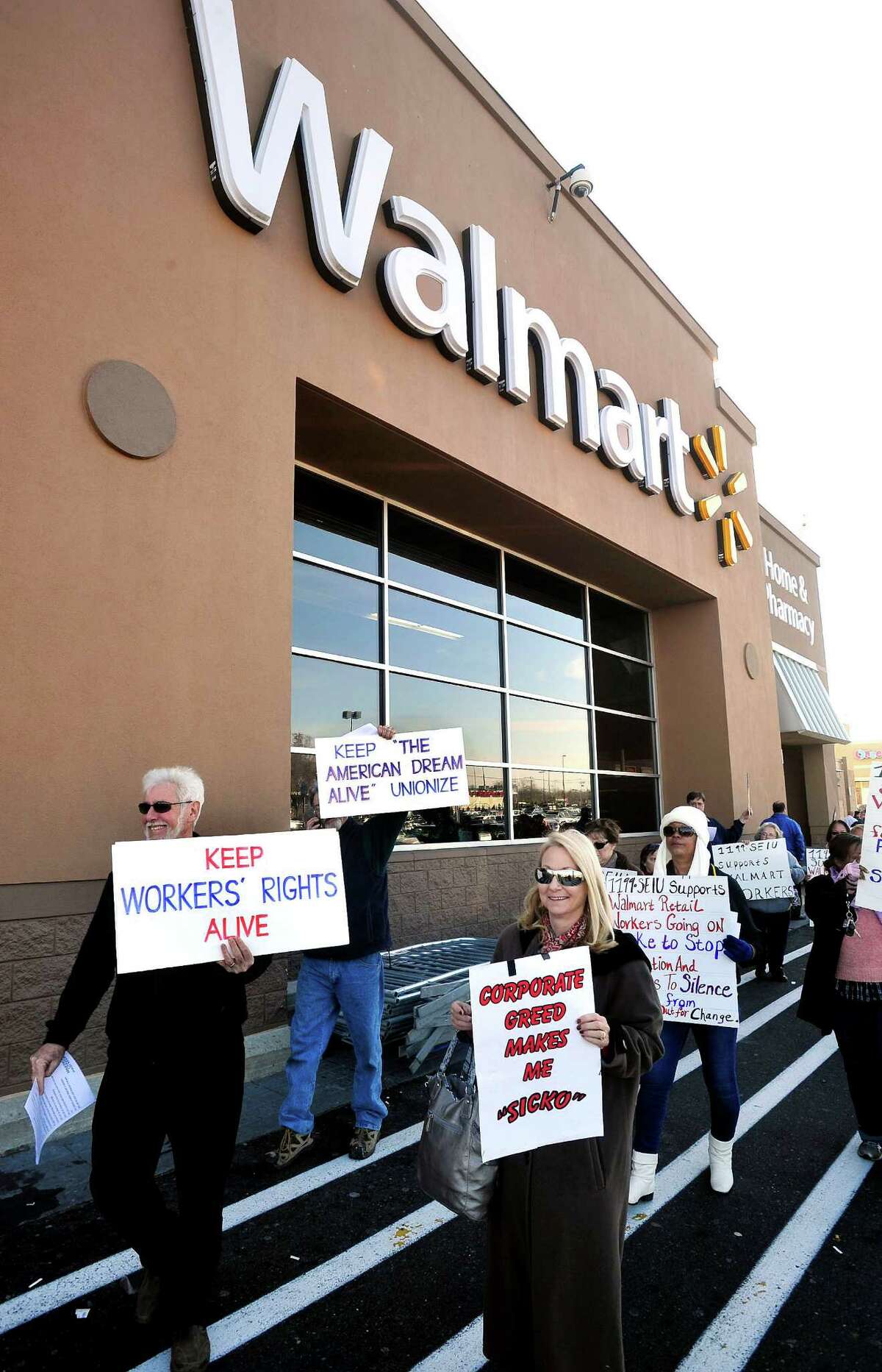 Prosters picket outside Walmart in Danbury during a demonstration Friday, Nov. 23, 2012.