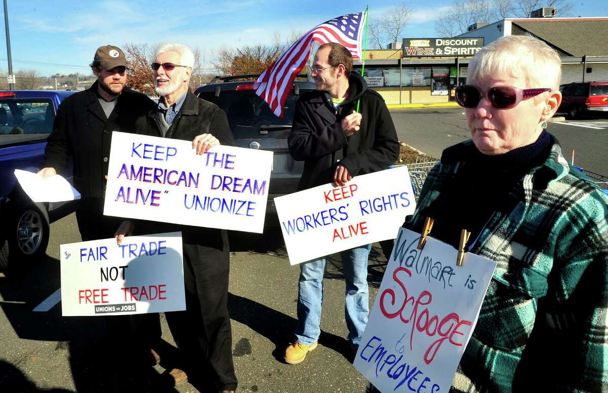 Prosters picket outside Walmart in Danbury during a demonstration Friday, Nov. 23, 2012. From left are Joe Hill, Mike Toto, Steve Navarra and Mary Lou Johnston.