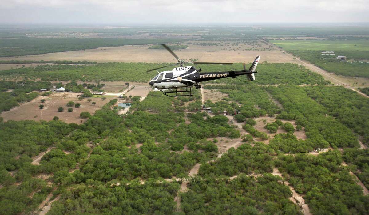 Texas Department of Public Safety officers patrol the Rio Grande River and surrounding area with high tech helicopters based in Edinburg earlier this year.